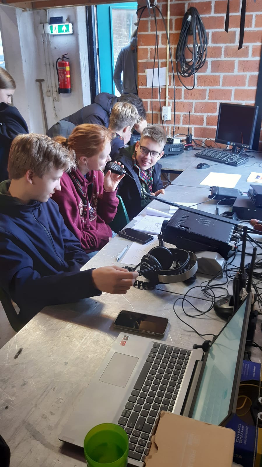 Young scouts using amateur radio equipment during JOTA 2025